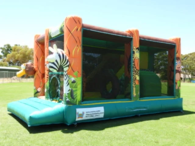 Obstacle course jumping castle jungle animals theme for hire from I Jump Jumping Castles Adelaide