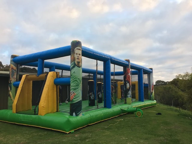 Inflatable soccer field set up in a park by I Jump Jumping Castles Adelaide