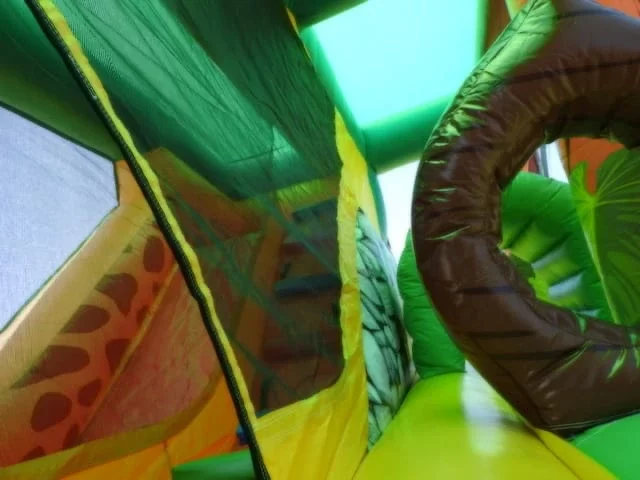 Obstacle course jumping castle jungle animals theme inside view